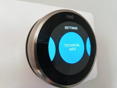 An electronic device installed to a white wall
