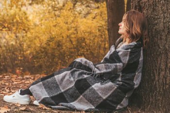 a woman wrapped herself in a blanket