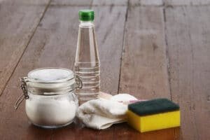 baking soda, vinegar, and scrubbing pad