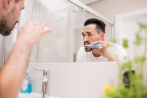man-looking-at-himself-in-the-mirror
