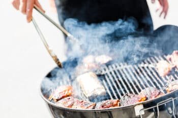 a man grilling meat