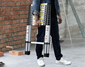 a worker carrying a climbing tool