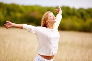 gleeful lady with outstretched arms