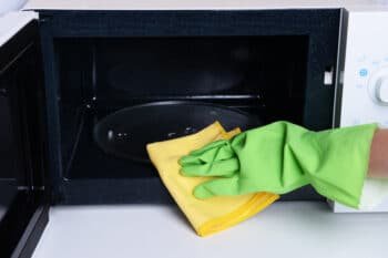 scrubbing an oven's turntable