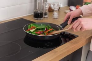 woman cooking in modern kitchen