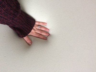 hand-of-a-woman-touching-her-soft-bed