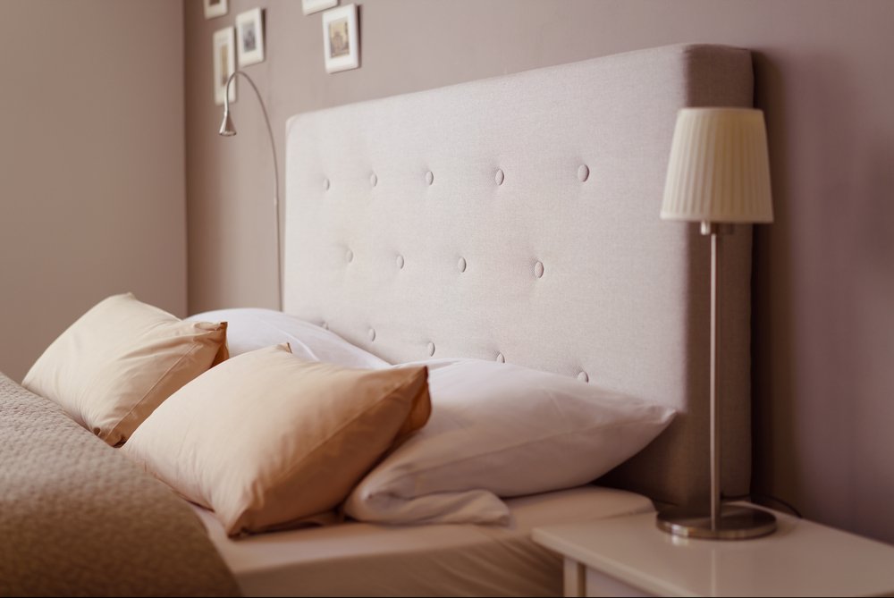 double bed with brown linen