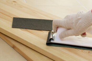 Sanding wooden piece before painting
