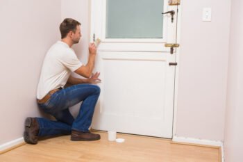 a worker repainting his room